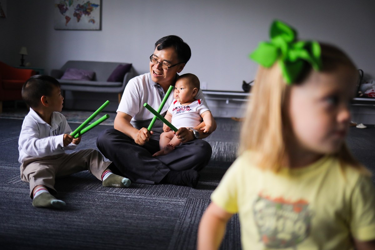 Children playing sticks. Music and movement research on how Kindermusik affects social-emotional development.